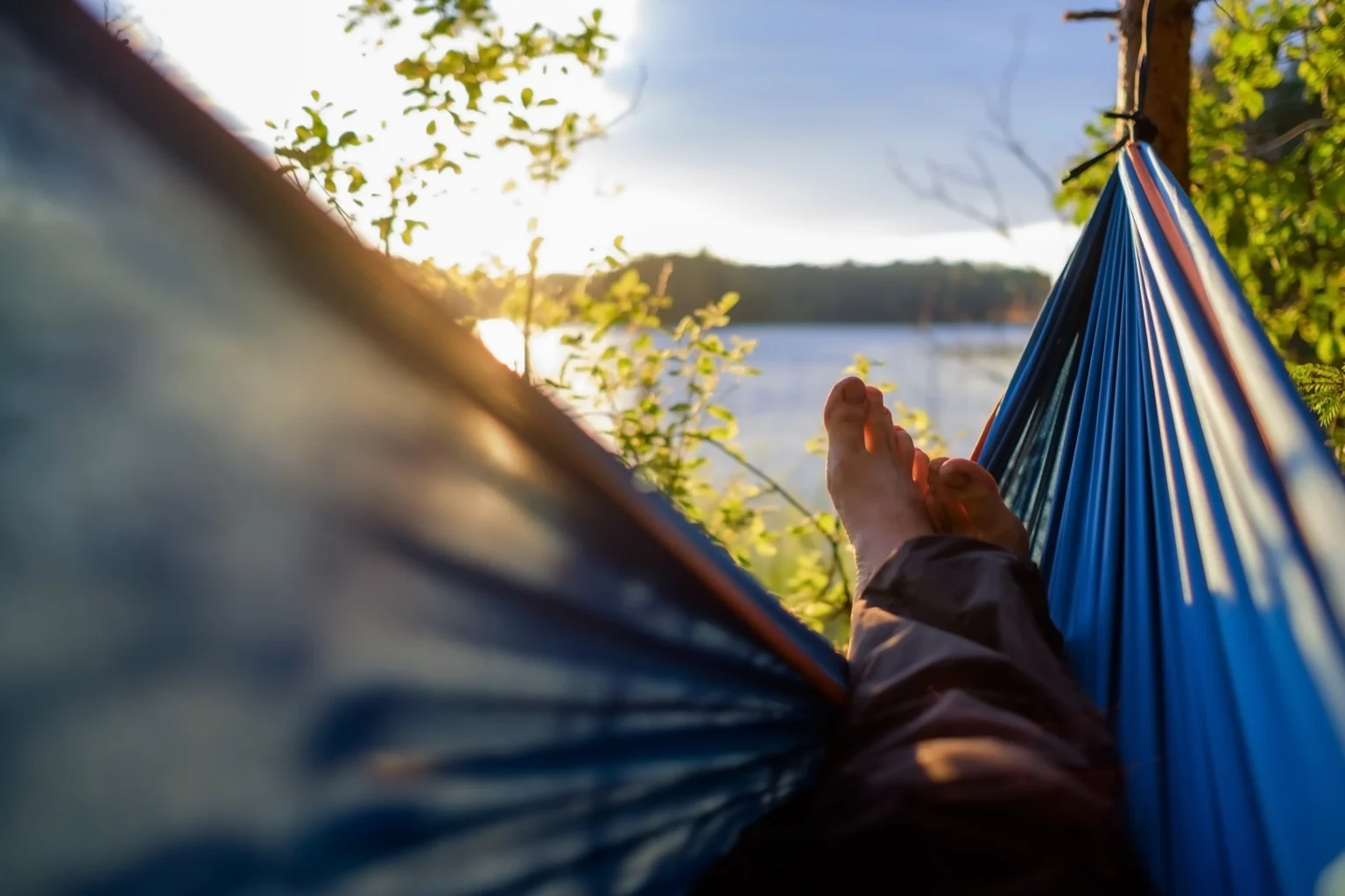 View over the lake from a hammock at sunset