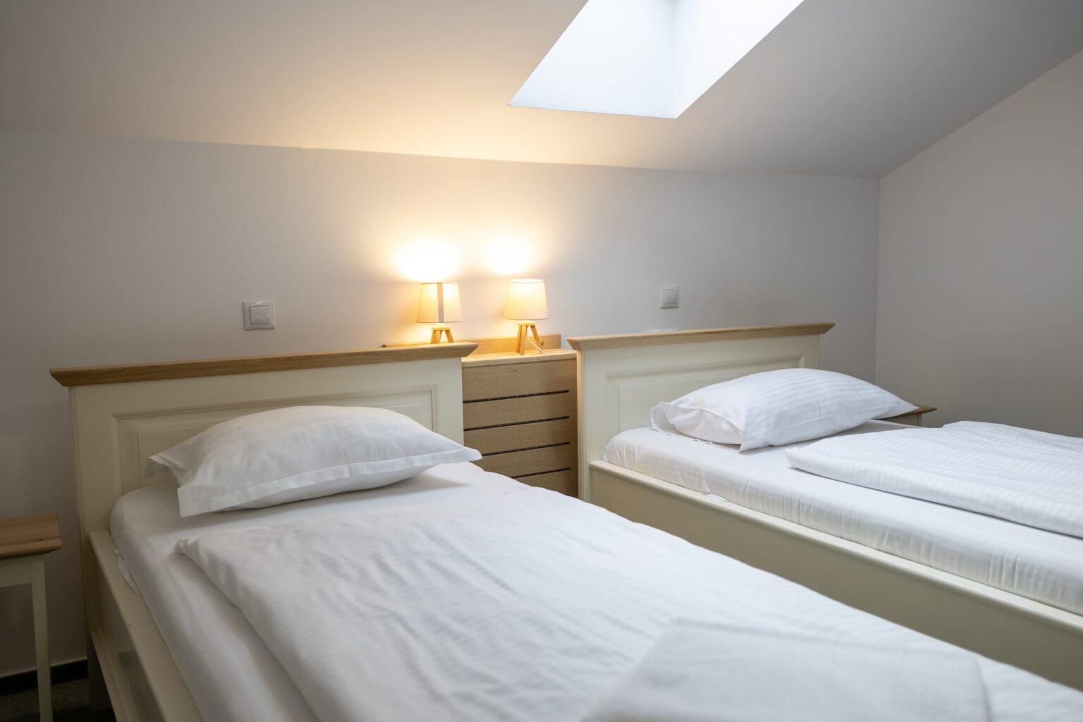 Junior Suite: the loft beds with bedside lamps